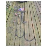 Assorted lawn ornaments, garden flag poles and