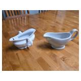 Two white glazed ceramic gravy boats