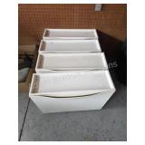 Four plastic storage drawers