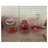 Three hummingbird feeders
