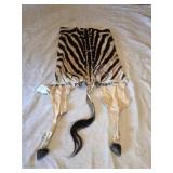 Partial zebra hide and hooves