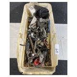 White container full of screws, nuts and bolts