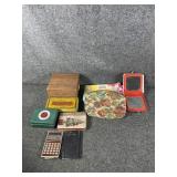 Gift boxes, travel bags, calculator, mirror