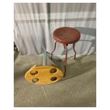 Red metal stool and drink holder for a van