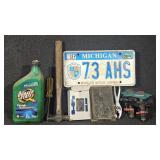 License plate, water sprinkler, chain saw chain