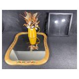 Mirror, picture frame, floral arrangement