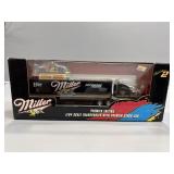 1:64 Premier Edition Transporter with stock car