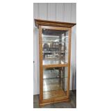 Lighted curio with sliding door