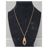 Gold Toned Necklace with Purple Gem Pendant