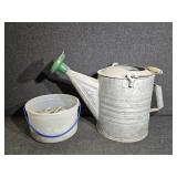 Metal watering can, pail of bolts