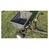 Pull behind spreader