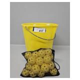 Assorted Golf Balls and Yellow Practice Golf Balls