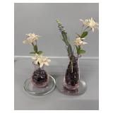 Pink vases with marbles on trivets