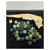 Assorted Green marbles, jawbone