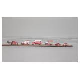 Glass tube with Coca-Cola cars in them
