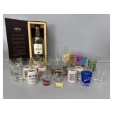 Rum bottle in wooden box, 35 shot glasses