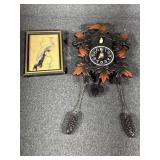 Cuckoo clock plastic. Feathered art picture.