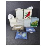 Decorative tissue box covers some with tissues