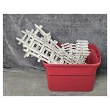 White Plastic Fencing Pieces In A Tub