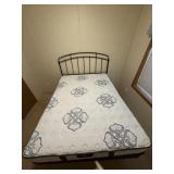 Serta Queen Bed with wrought iron headboard.