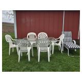 Patio Table with Plastic Chairs and Lounger