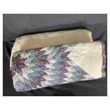 Quilt With A Floral Patterned Border