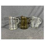 Clear Glass Pitchers(2), Amber Pitcher(1)