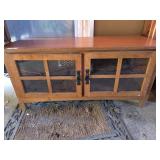 Wooden entertainment stand with glass doors
