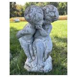 Cement Children Telling  a Secret in the Garden