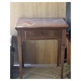 Sewing machine stand with drop down drawer