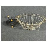 White hanging metal basket , black stand