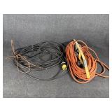 Orange Extension Cord On A Reel, Black Power Cord