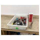 Various kitchen tools in bin