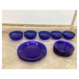 Variety of cobalt glass plates and dishes