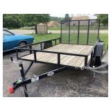LIKE NEW DROP GATE TRAILER