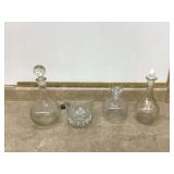 Three glass decanters & ice bucket