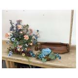Decorative floral display on wooden shelf