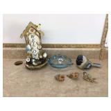 Bird figurines blue glass bowl