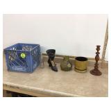 Various flower pots and other items stored in plastic crate