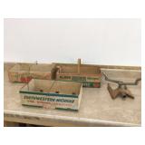 Three vintage tomato boxes and sprinkler