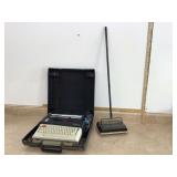 Antique typewriter and floor sweeper