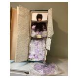 Elegant porcelain doll with lavender and lace details Elegant porcelain doll with lavender and lace details