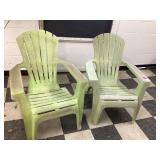 Two green plastic chairs Two green plastic chairs