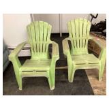 Two green plastic chairs Two green plastic chairs
