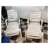 Two white plastic chairs Two white plastic chairs