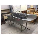 Large commercial sink with damaged legs