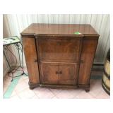 Vintage RCA Victor Victrola radio record player in cabinet with original booklet