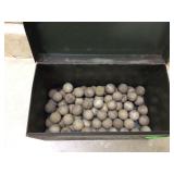 Antique bingo balls in metal container