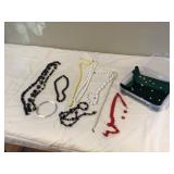 Various vintage beads in container