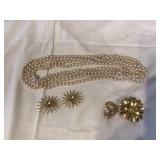 Vintage jewelry collection of glass beads earrings and brooches